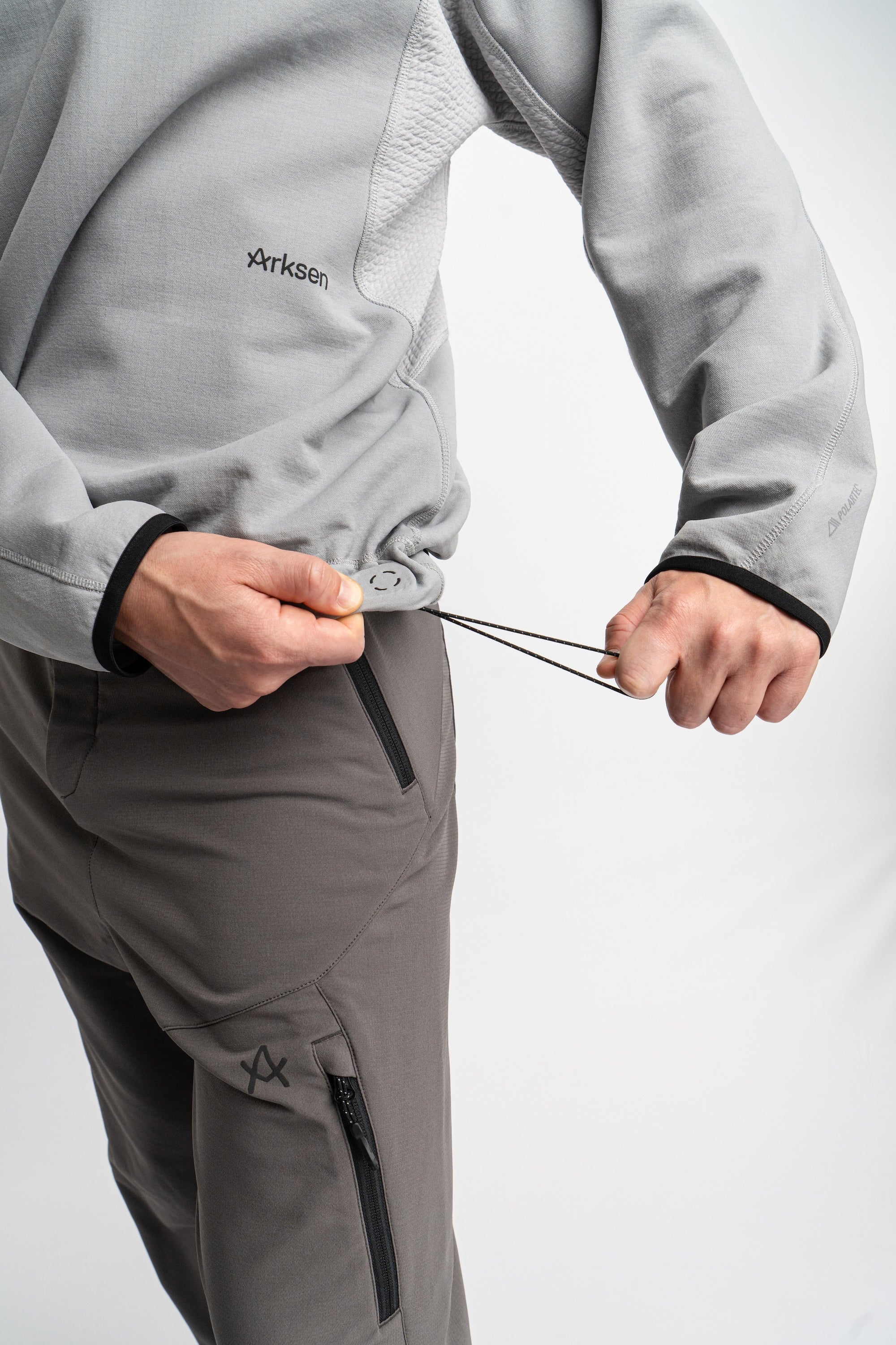 Cohaesive® cord lock adjusters to hem